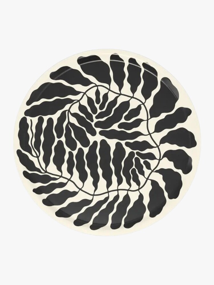 Round serving tray with charcoal leaf motif by Linnéa Andersson for Wrap