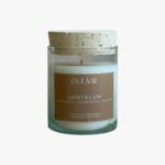 Santalum scented candle by Olfair in a clear glass with cork lid, warm sandalwood fragrance handmade in Zürich
