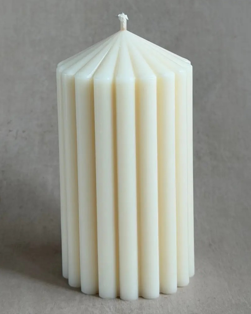Nordic cylinder candle by Olfair with bold ribbed texture, handmade in Zürich from natural olive wax