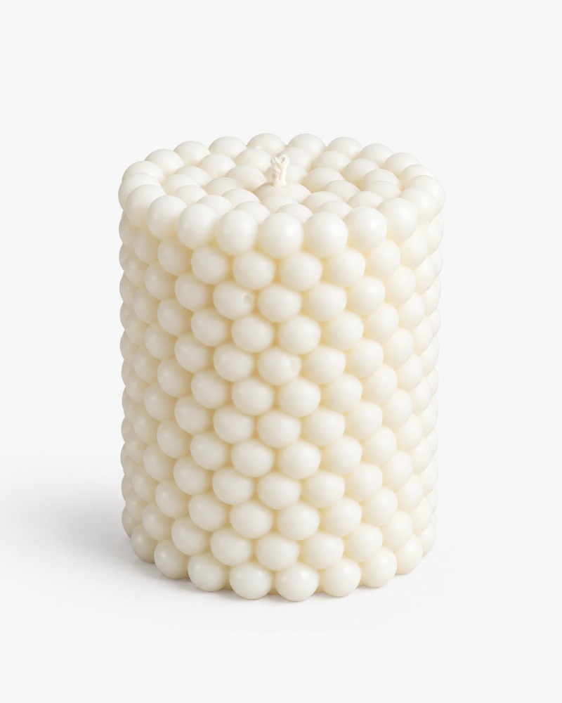 Bubbles cylinder candle by Olfair with raised spherical relief texture, handmade in Zürich from natural olive wax