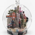 Hong Kong Christmas ornament by Charlotte Bourrus, 8 cm glass snow ball showing the Victoria Harbour skyline and a junk boat
