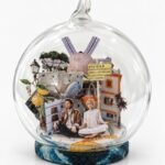 Ibiza Christmas ornament by Charlotte Bourrus, 8 cm glass snow ball showing the old town of Dalt Vila and its cathedral